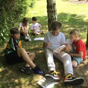 Students reading outdoors